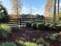 Country garden fence lake landscape fall shadows Royalty Free Stock Photo