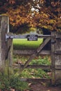 Country Gate displaying Dogs on Lead Please Sign Royalty Free Stock Photo