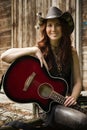 Country girl with guitar Royalty Free Stock Photo