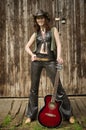 Country girl with guitar Royalty Free Stock Photo