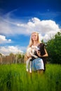 Country girl with a small goat in her hands