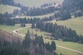 country gravel road leading up to the mountains - vintage retro Royalty Free Stock Photo