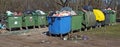 Full garbage waste cans pollute spring forest and nature