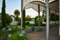 Country home porch and garden on a summer afternoon