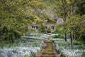 Country House at the End of a Flower Lined Lane Royalty Free Stock Photo