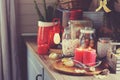 Country house kitchen decorated for Christmas and new year Holidays. Marhmallows, candles, cocoa and nuts in modern jars Royalty Free Stock Photo