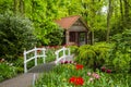 Country house and white bridge in Keukenhof gardens Royalty Free Stock Photo