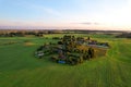 Country houses in the countryside. Aerial view of roofs of green field with rural homes. Village with wooden home. Suburban house Royalty Free Stock Photo