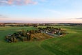 Country houses in the countryside. Aerial view of roofs of green field with rural homes. Village with wooden home. Suburban house Royalty Free Stock Photo