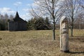 Pagan wooden statue with the church at the background