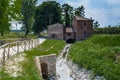 Country mill along dry river