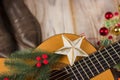 Country music background with guitar and christmas decoration Royalty Free Stock Photo