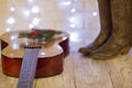 Country music christmas with guitar and cowboy shoes Royalty Free Stock Photo