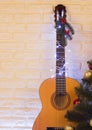 Country music christmas background with guitar on brick wall Royalty Free Stock Photo