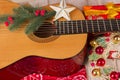 Country music christmas background with guitar and cowboy bandanna Royalty Free Stock Photo