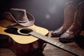 Country music festival live concert with acoustic guitar, cowboy hat and boots Royalty Free Stock Photo