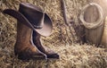 Country music festival live concert or rodeo with cowboy hat and boots in barn