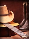 Country music with guitar and cowboy clothes Royalty Free Stock Photo