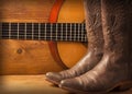 Country music with guitar and cowboy shoes Royalty Free Stock Photo