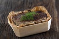 Country pate with meat and liver on wooden background