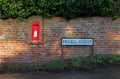 Country postbox and road sign Royalty Free Stock Photo