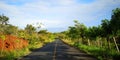 Country road across mountain with sea Royalty Free Stock Photo