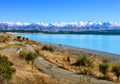 The country road along the Lake Tekapo and snowy mountains in autumn, Canterbury, South Island, New Zealand Royalty Free Stock Photo