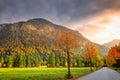 Country road in Alps at dramatic autumn sunrise, Karwendel mountains, Tyrol Royalty Free Stock Photo