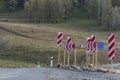 Repair of the main road. Men at work. Bright pointers. Royalty Free Stock Photo