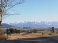 Country road with beautiful snowcapped mountains in the background