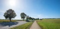 country road with cars, bike way beside. travel route to Bad tolz