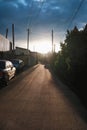 Country road with cars in the sunset atmosphere