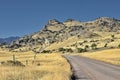 Country road curves gently uphill in Montana Royalty Free Stock Photo