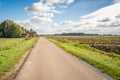 Country road in a Dutch polder Royalty Free Stock Photo