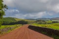 Country road Fields with blue sky and clouds near gruta do Natal in municipality of Praia da Vitoria, Terceira Royalty Free Stock Photo