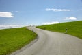 Country road in a hilly landscape Royalty Free Stock Photo