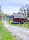 A country road and Rustic red barn in Michigan usa Royalty Free Stock Photo