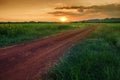 Country Road To Mountain And Sunset Sky In Agriculture Field Lop