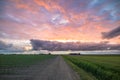 Country road under a dramatic colorful sky Royalty Free Stock Photo