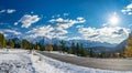 Country road in valley of forest in a snowy autumn sunny day. Tunnel Mountain road, Banff National Park, Canadian Rockies. Royalty Free Stock Photo