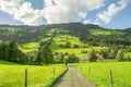 Country road in Westendorf, Brixental Valley in Tirolean Alps, Austria, Royalty Free Stock Photo