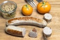 Country sausage with yellow tomato and coarse mustard Royalty Free Stock Photo