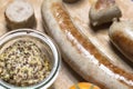 Country sausage with yellow tomato and coarse mustard Royalty Free Stock Photo