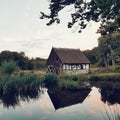 The country side in sweden, house, pond, sunset and nature
