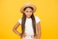 Country style. small beauty. happy kid on yellow background. she love summer vacation. spring fashion for kids Royalty Free Stock Photo