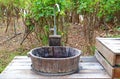 Country style water faucet with wooden bucket sink Royalty Free Stock Photo