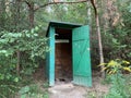 Country toilet in the open air. Wooden structure for outdoor toilet. Cabin - Toilet in the woods