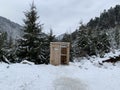 Country toilet in the winter outdoors. Outdoor toilet construction. Cabin - Toilet in the forest on the snow