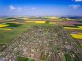 Country village surounded by crop fields in the spring Royalty Free Stock Photo