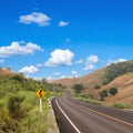 Country winding road sign with blue sky